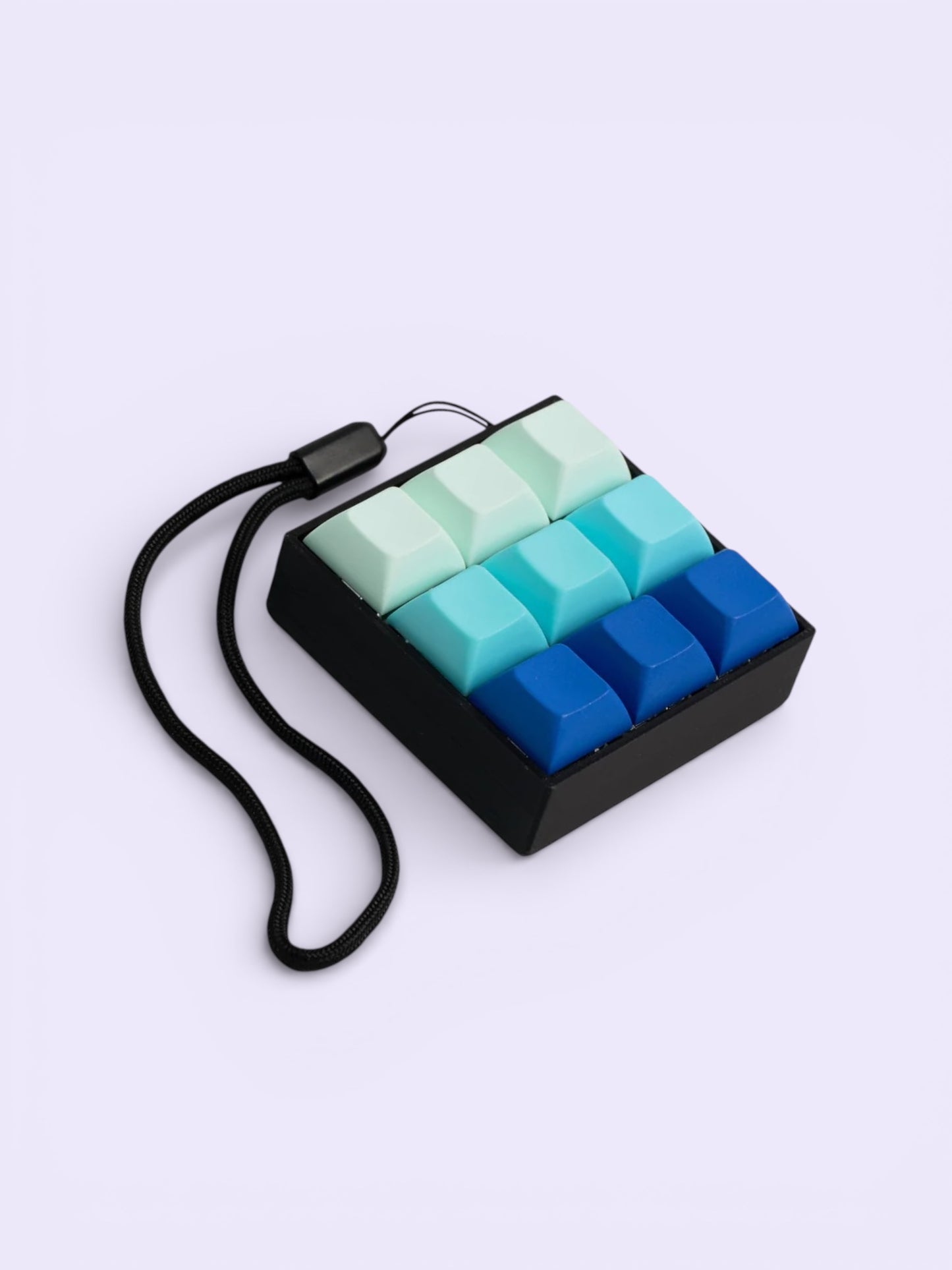 Colorful keycap click toy with gradient keys on a light purple background
