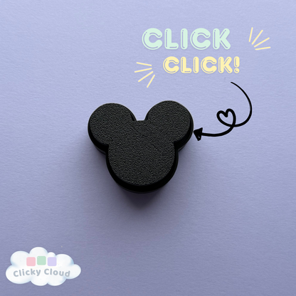 Black mouse ear keychain on a purple background with 'Click Click!' text and Clicky Cloud logo.