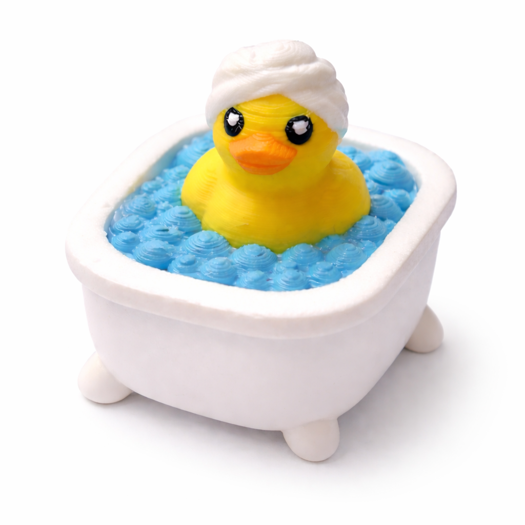 Yellow rubber duck with a towel on its head in a small bathtub filled with blue water on a white background
